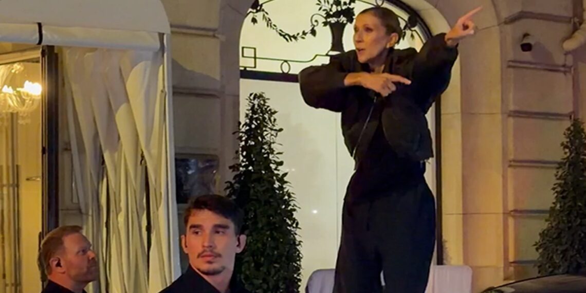 Celine Dion zingt blote voeten op een BMW na haar concert in Parijs.
